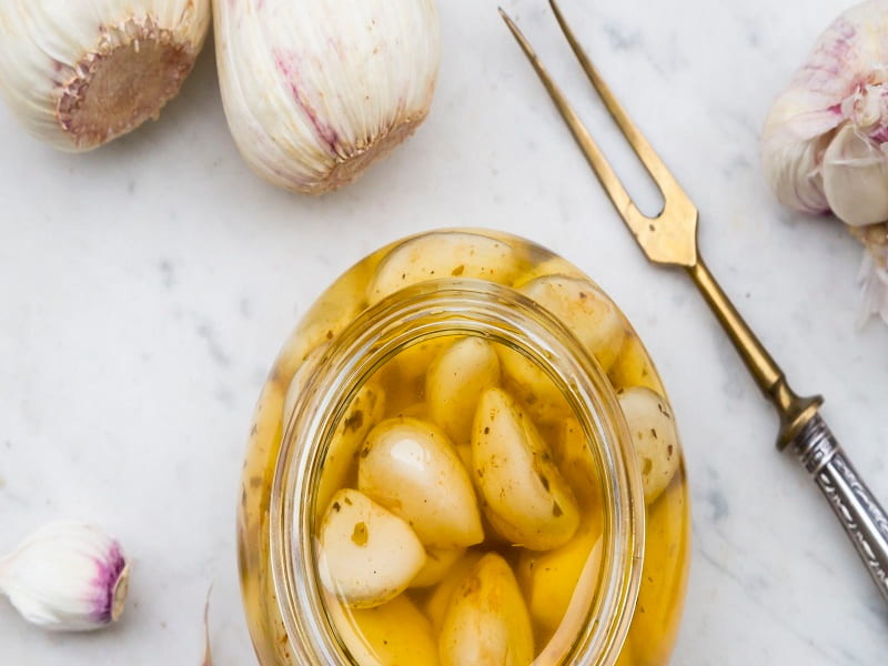 fresh-and-pickled-garlic-cloves-and-a-fork-on-white-marble-490662361-588bb0bd3df78caebc8a31ce (2)