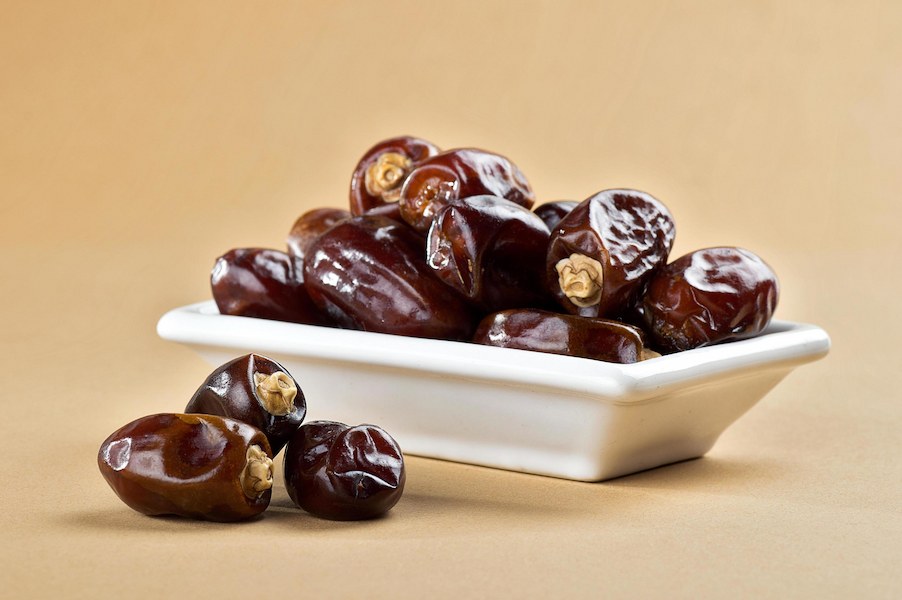 dried-dates-on-minimal-background-free-photo