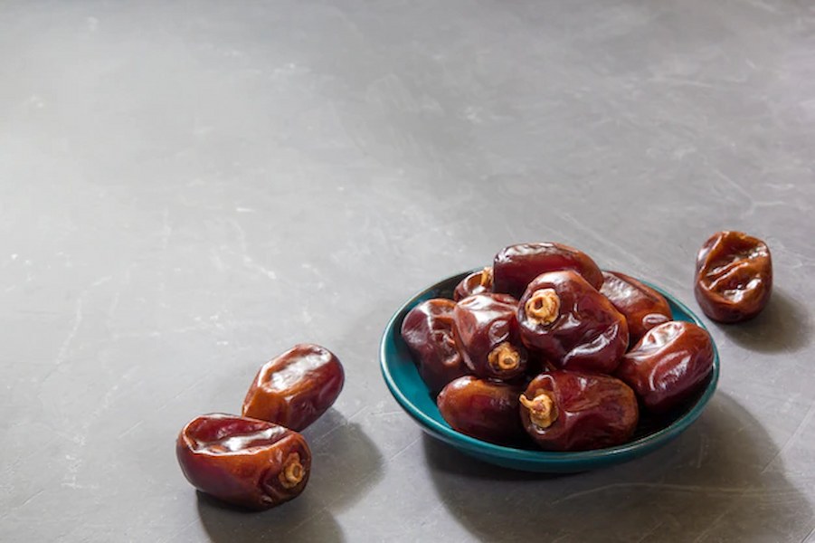 delicious-pitted-dates-gray-table-ramadan-iftar-food-concept-copy-space_89245-77