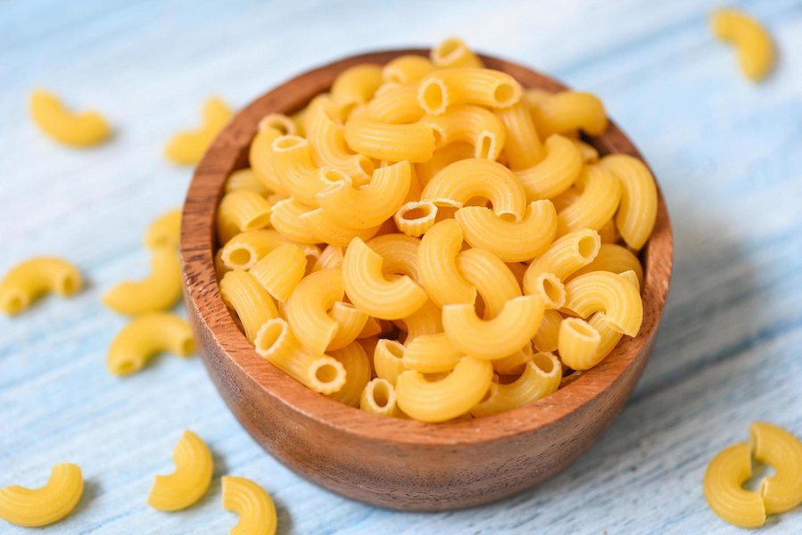 macaroni-top-view-on-wooden-bowl-background-close-up-raw-macaroni-uncooked-delicious-pasta-or-penne-noodles-free-photo