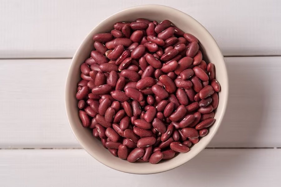 top-view-red-beans-bowl-white-wood_73966-1665