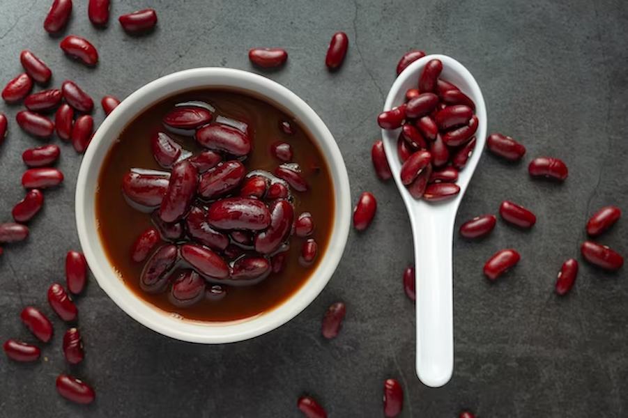 red-bean-boiled-white-bowl-with-red-bean-seed-spoon-place-dark-floor_1150-35298