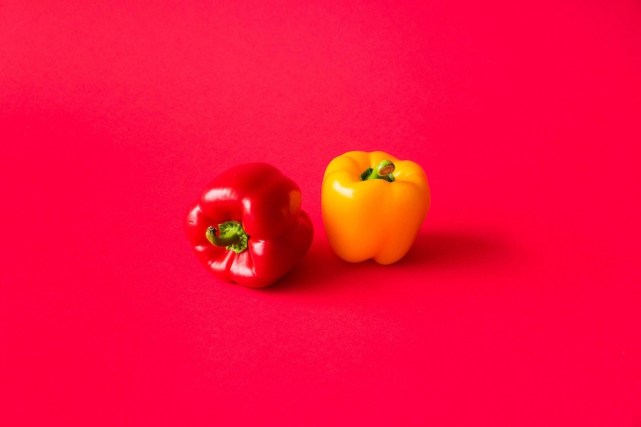 red-and-yellow-paprika-peppers-on-flat-background-still-life-free-photo-2210x1473