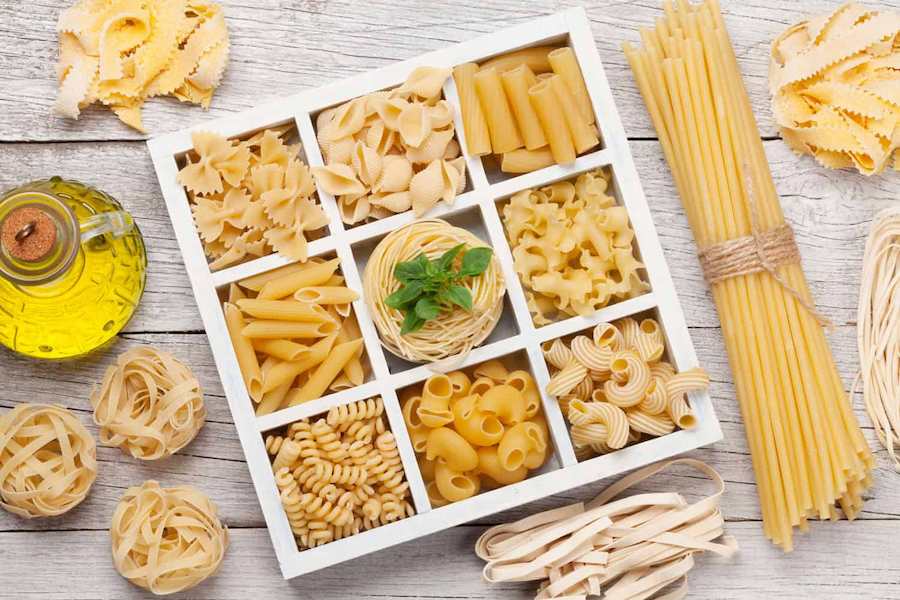 Various-pasta-in-wooden-box.-Top-view-flat-lay