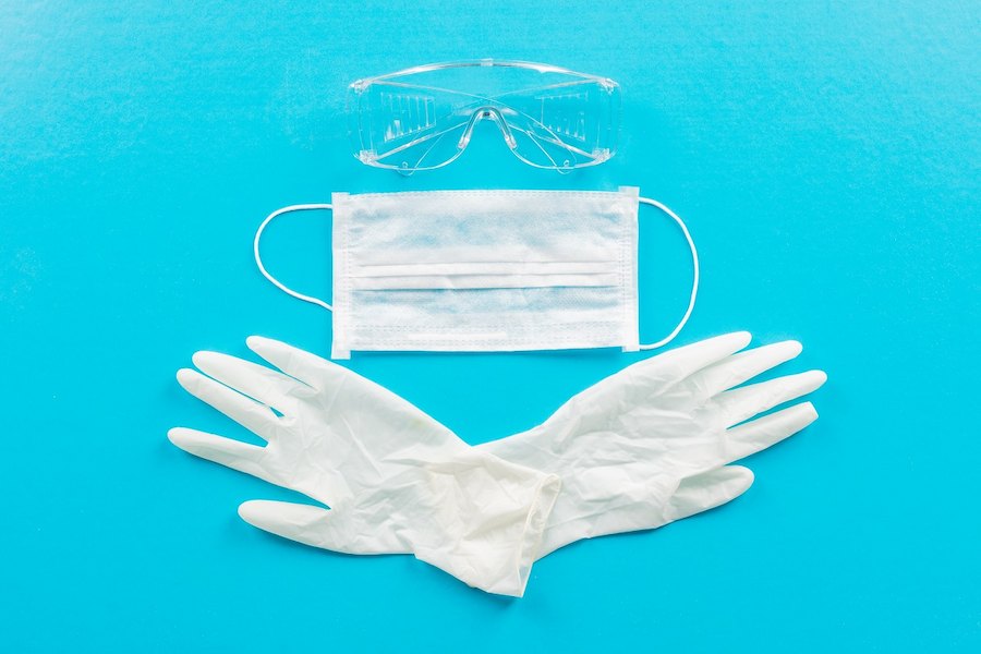 top-view-medical-gloves-with-mask-eyeglasses-horizontal