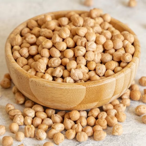 bowl-of-raw-dry-chickpea-on-white-table-close-up_202769-5259
